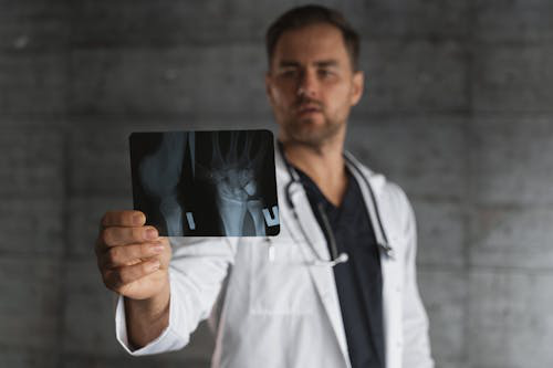 A person screening a bone X-ray